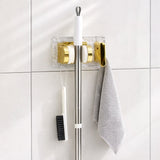 Space saving broom and mop hanger